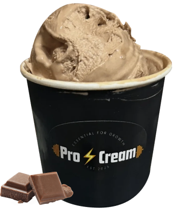 A cup of chocolate ice cream with pieces of chocolate beside it.